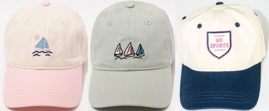 three baseball caps with sports related graphic designs embroidered on them