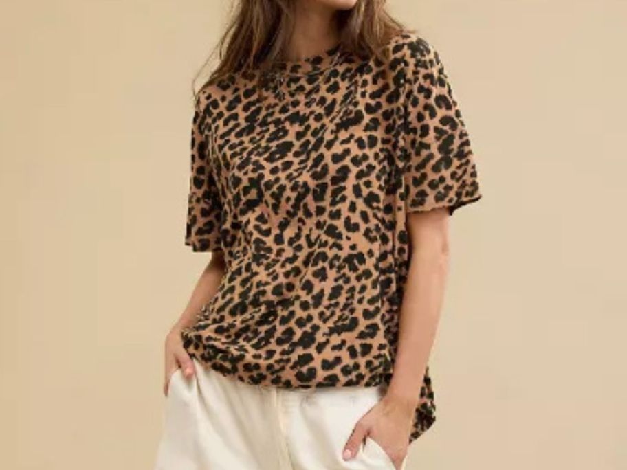 A woman wearing a cheetah print t shirt