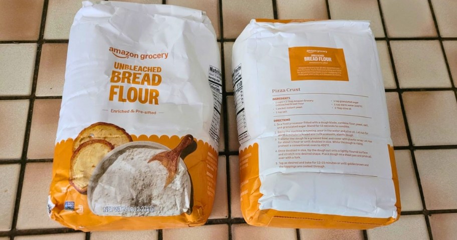 two Amazon Grocery Unbleached Bread Flour 5lb Bags on countertop