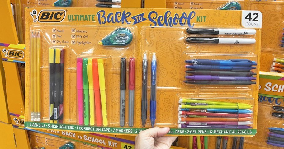 hand holding a back to school essentials kit