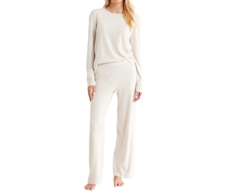 stock photo of woman wearing cozy white pajamas