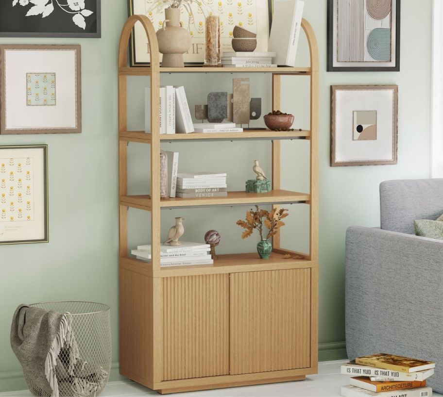 a 3 shelf bookcase in honey colored wood