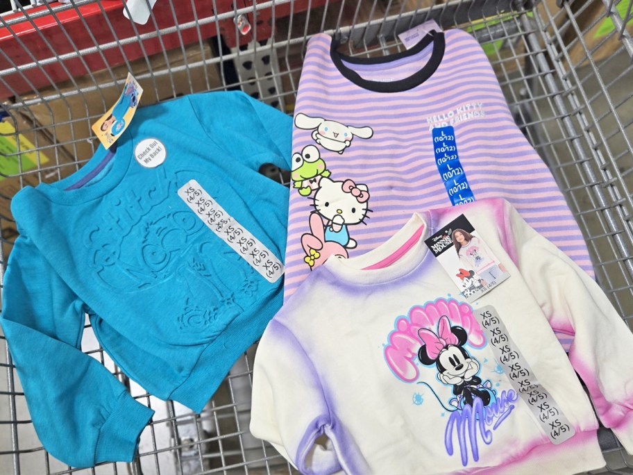 stitch, hello kitty, and minnie mouse sweatshirts in shopping cart
