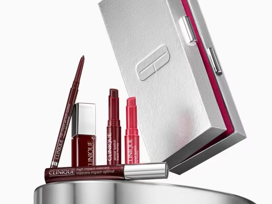 A clinique black honey lip vault with 4 clinique products and a clutch