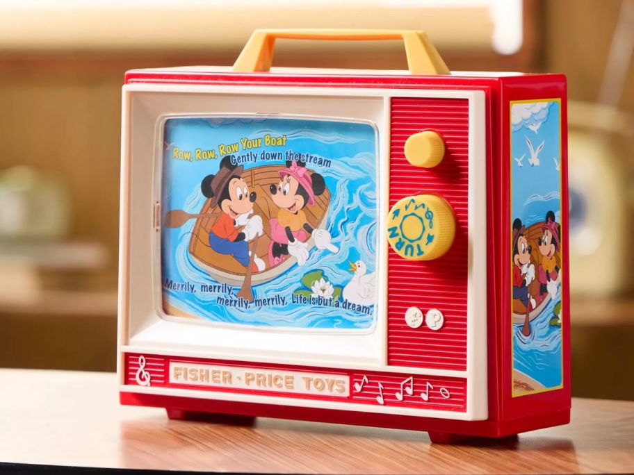 A retro kid's tv toy with Mickey and Minnie Mouse on it 