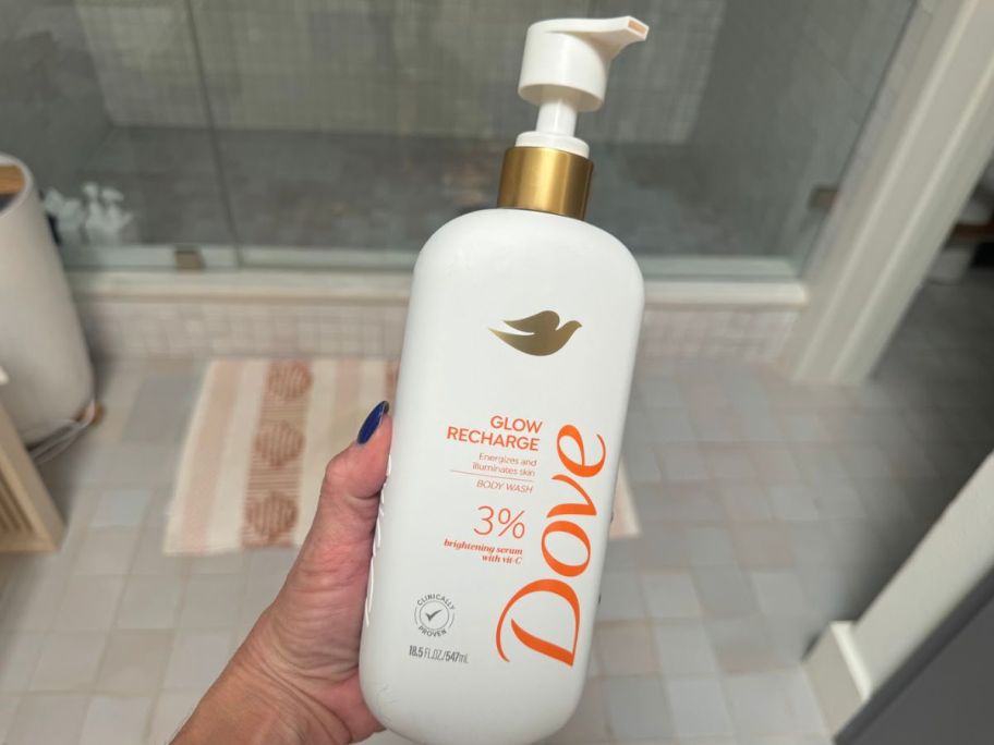 hand holding Dove Serum Body Wash - Glow Recharge