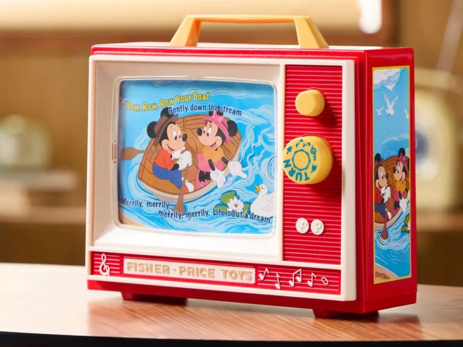 A Fisher Price Mickey Mouse Two-Tune TV on a table