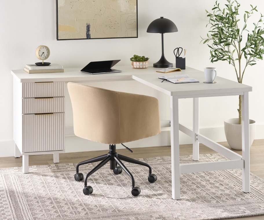 an l-shaped desk and chair