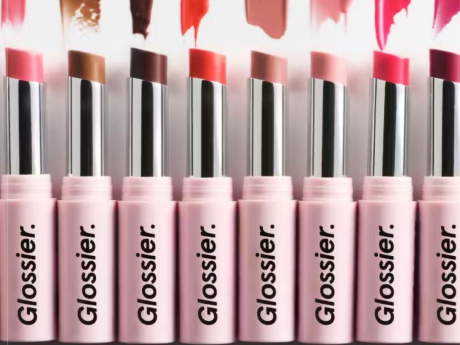 Several tubes of Glossier High Shine Lipstick