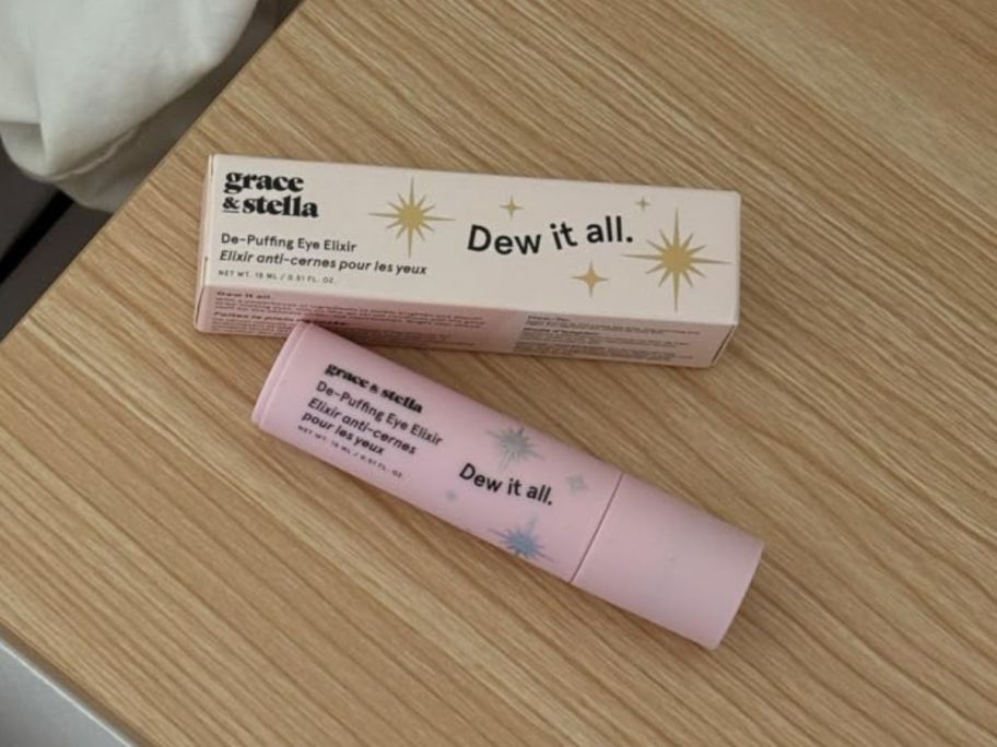 Grace & Stella Dew it All tube and box on a wooden table