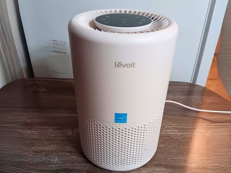 a small white air purifier in a living room
