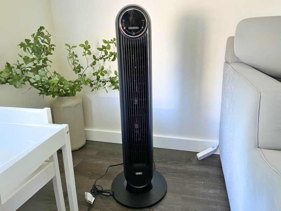 a black tower fan in a living room