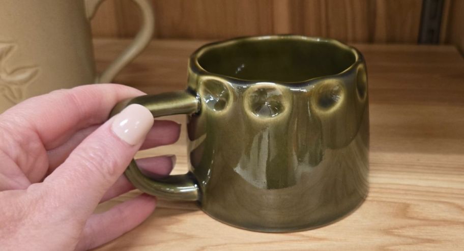 hand holding Hearth & Hand with Magnolia 10oz Carved Edge Ceramic Mug