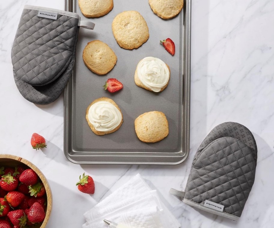 two gray mini oven mitts