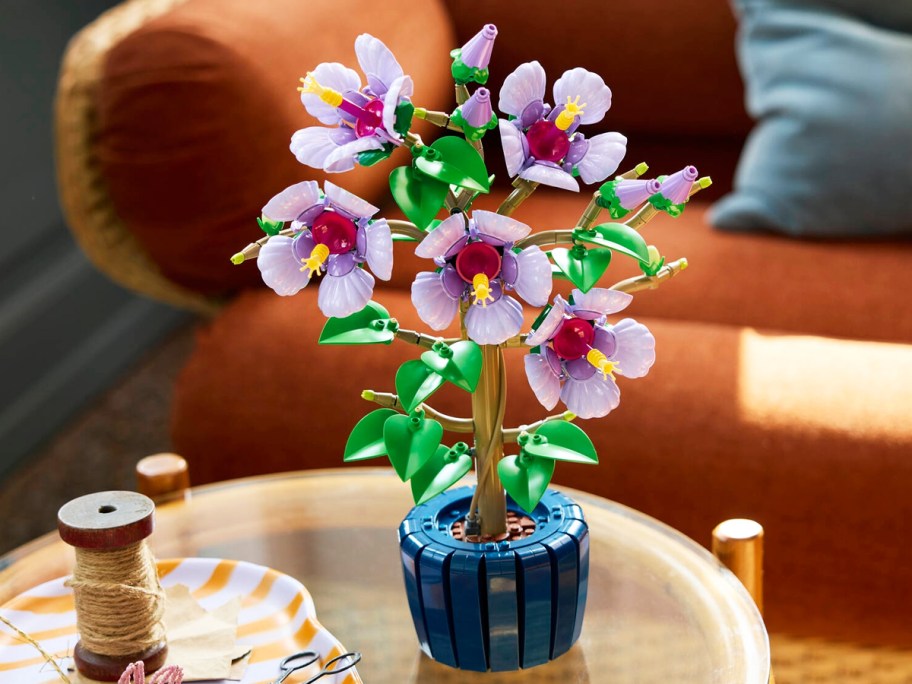 purple hibiscus tree lego set on coffee table