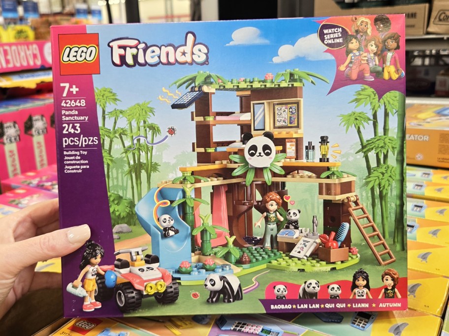 hand holding up box for LEGO Friends Panda Sanctuary set in store