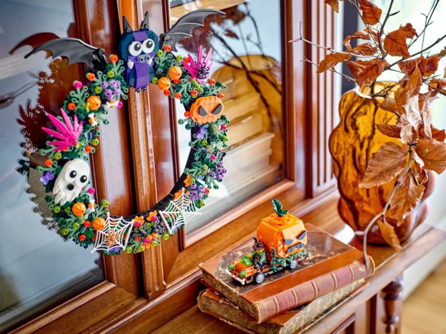 LEGO Halloween Wreath with bats and ghosts on a cabinet