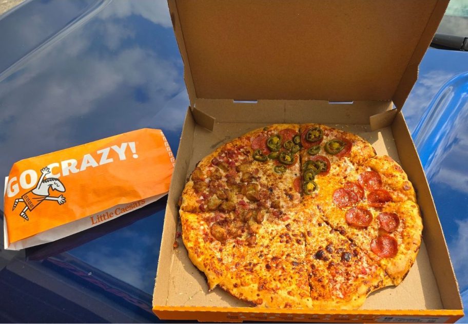 A pack of Little Caesar's breadsticks next to a Fantastic 4 Pizza