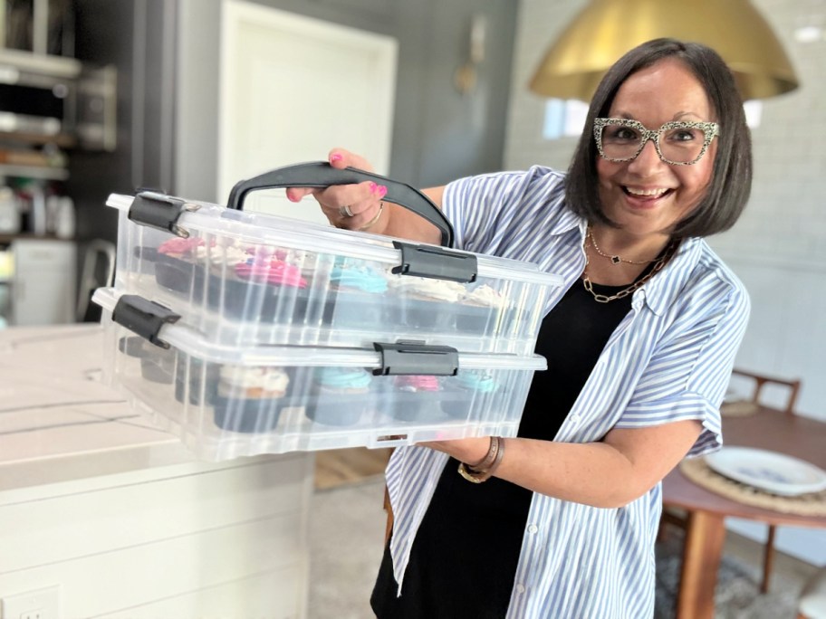 woman holding up 2 Mainstays cupcake carriers