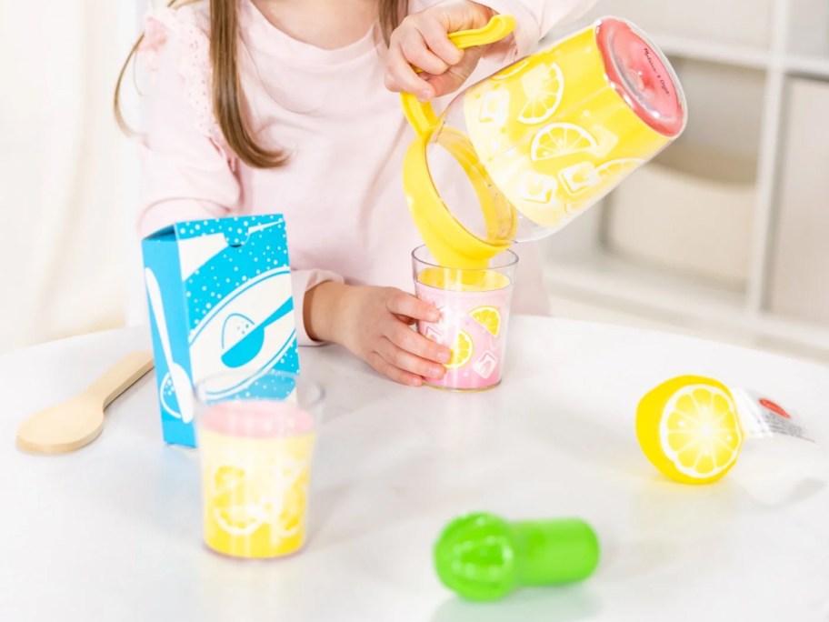 child playing with a lemonade themed playset