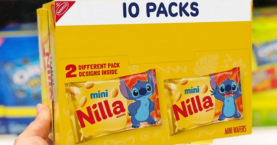 hand holding up a yellow box of Nilla Wafers Mini Cookies snack packs