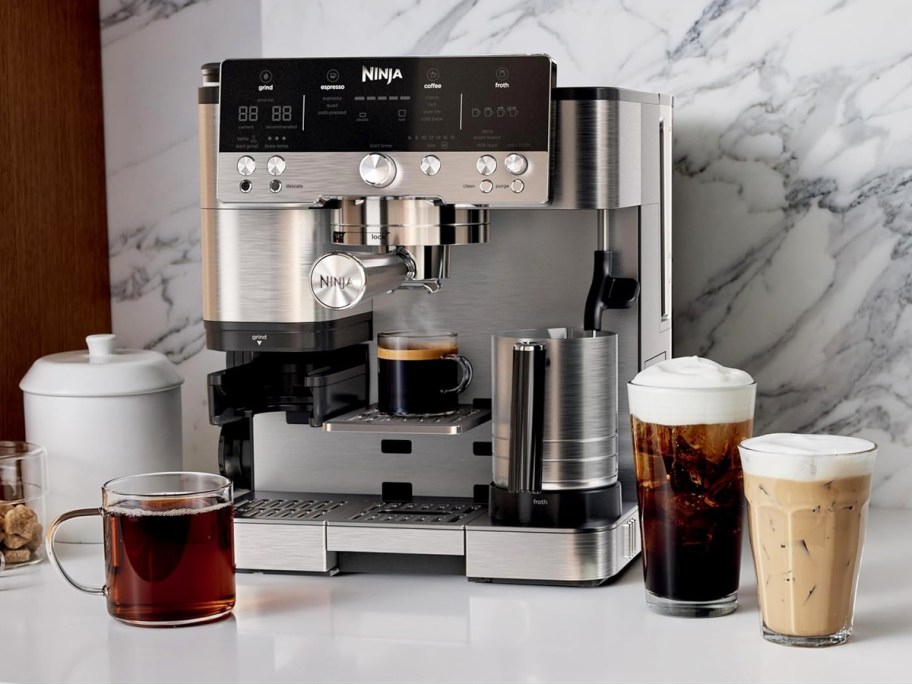 ninja luxe coffee machine with cups of coffee next to it
