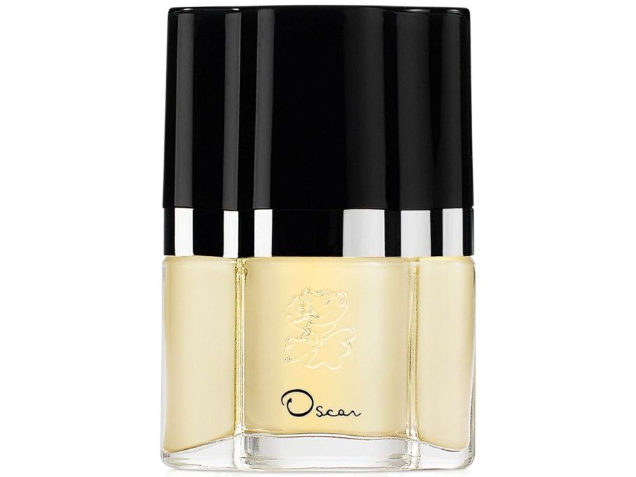 A black and yellow bottle of Oscar de la Renta Eau de Toilette Spray 