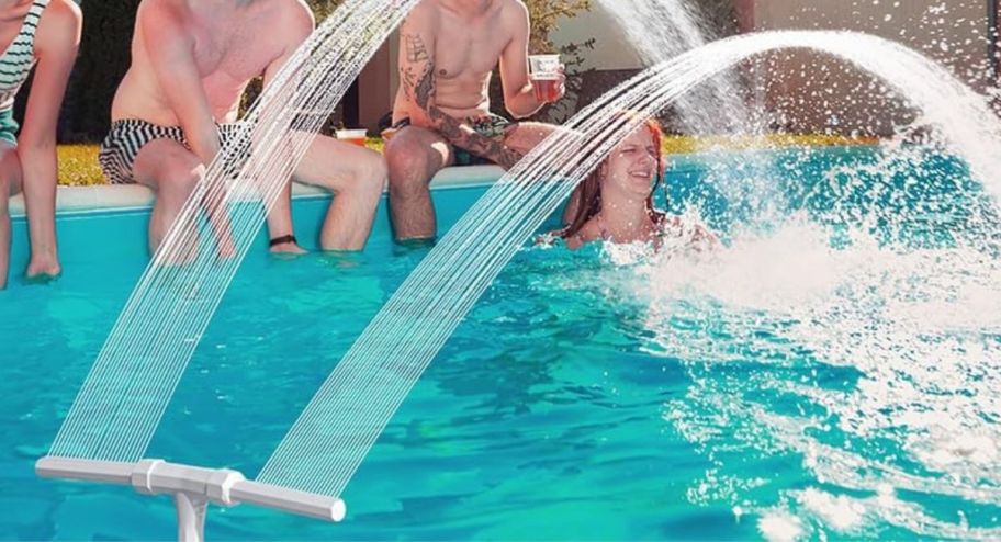 Pool Fountain Cooling Jet with people inside of the pool