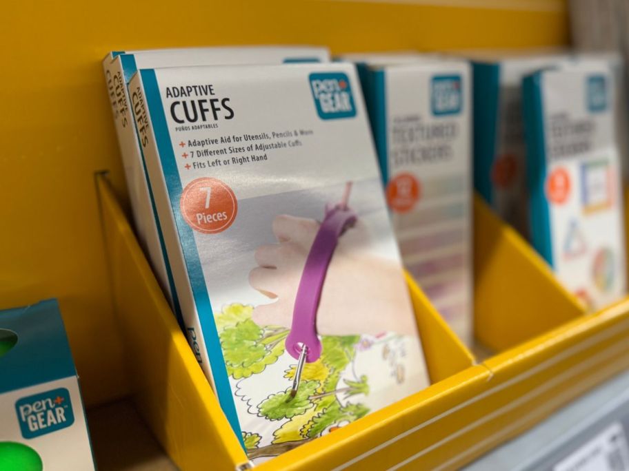 A white box containing an adaptive cuff for writing 