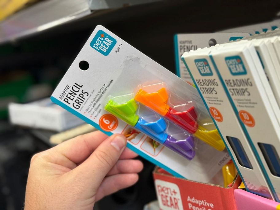 A person pull out a pack of Pen+Gear Pencil Grips