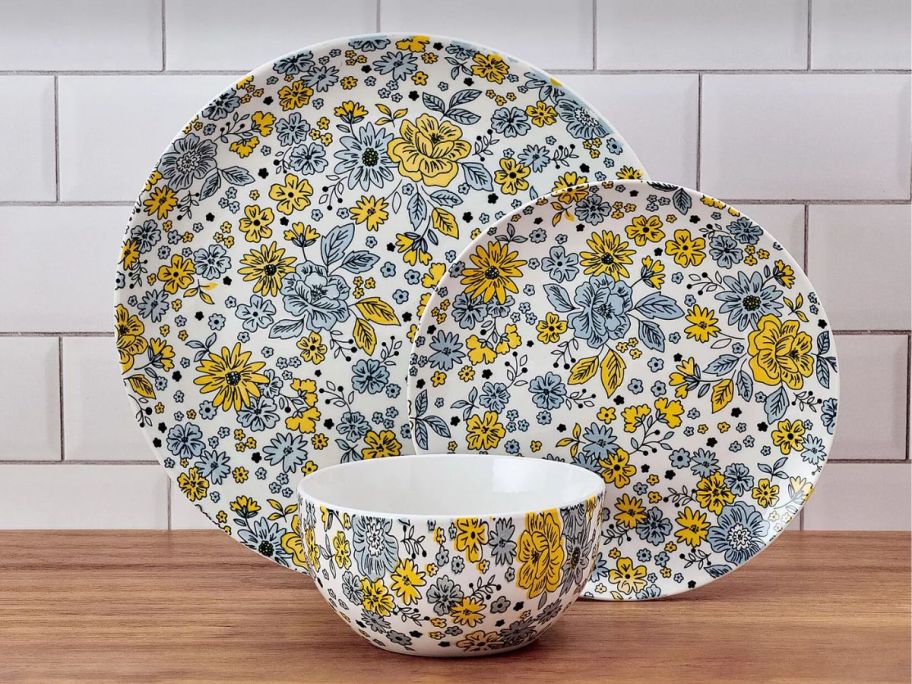 display of Pfaltzgraff Vibrant Garden 12-Piece Dinnerware Set on top of a table 
