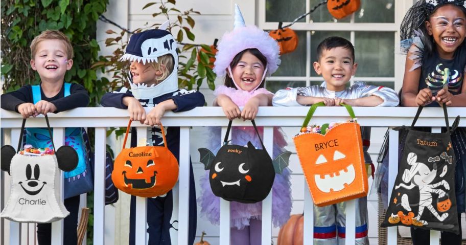 Kids holding Pottery Barn Halloween Treat Bags