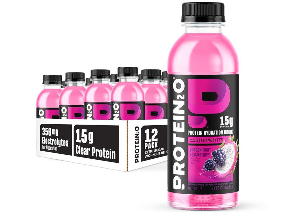 case of purple Protein2o Hydration Drink bottles with one large bottle in front of it