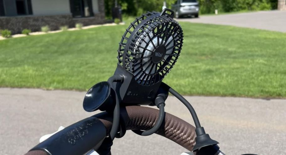 Robot Clip-on Stroller Fan wrapped around a stroller handle