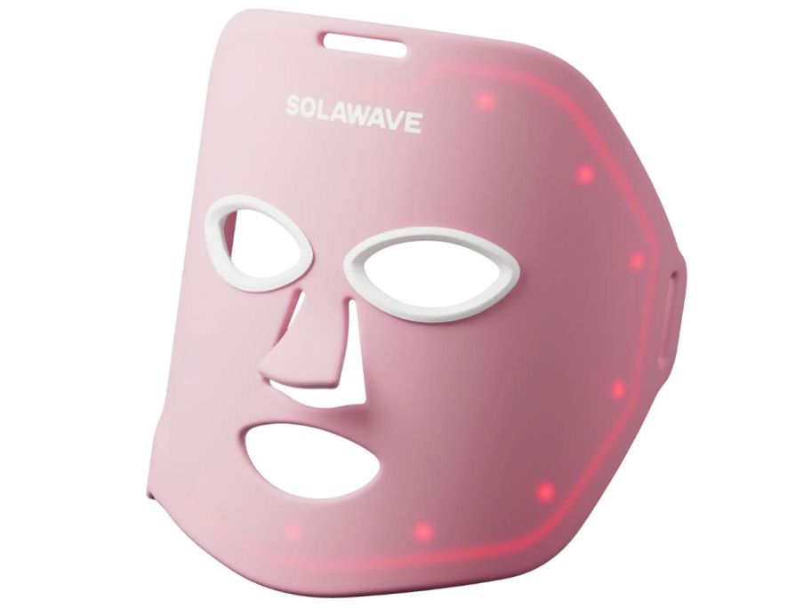 A pink solar wrinkle retreat mask with red lights on the sides