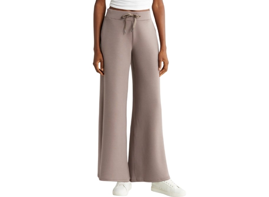 stock photo of women wearing beige modal sweatpants