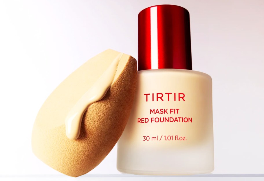 bottle of liquid foundation and a blending sponge