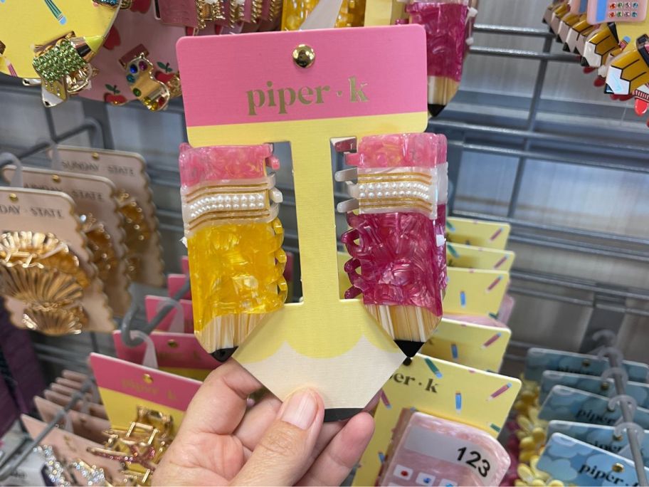 2 claw clips in the shape of pencils