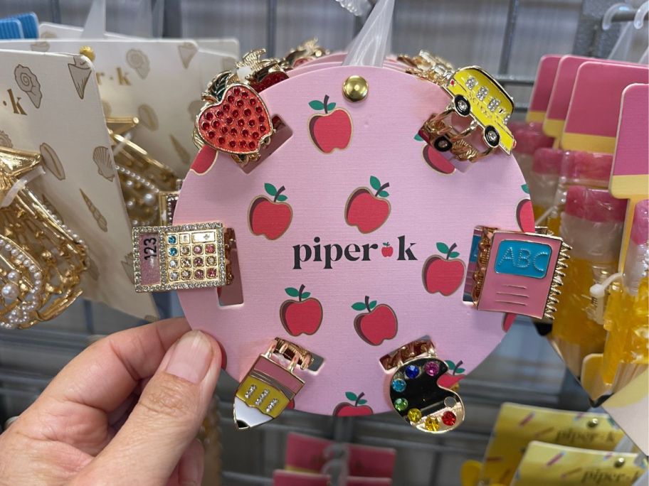 tiny hair clips in the shape of school subject items 
