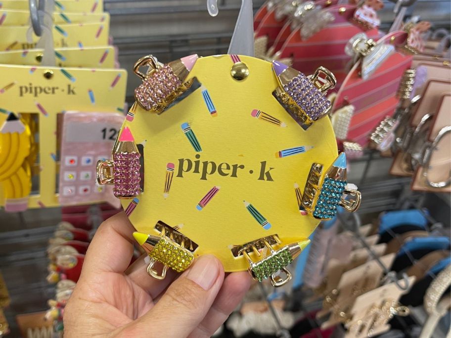 tiny hair clips in the shape of school subject items 