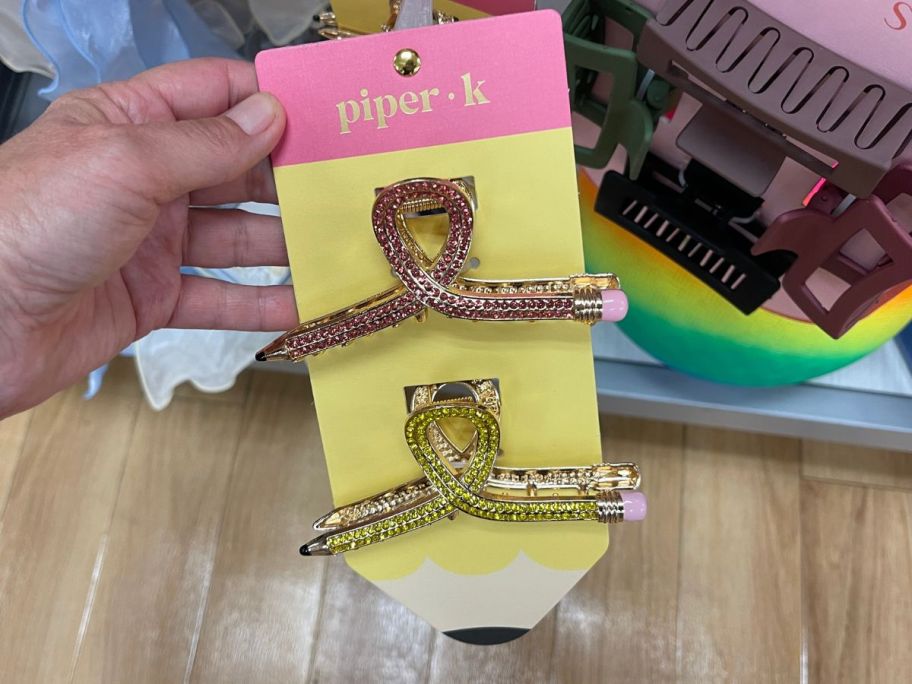 2 claw clips in the shape of pencils