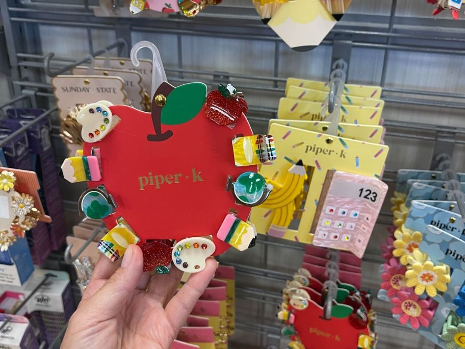 tiny hair clips in the shape of school subject items 