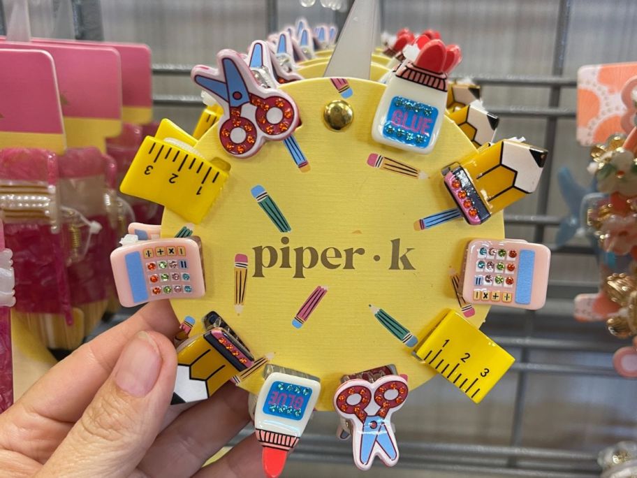 tiny hair clips in the shape of school subject items 