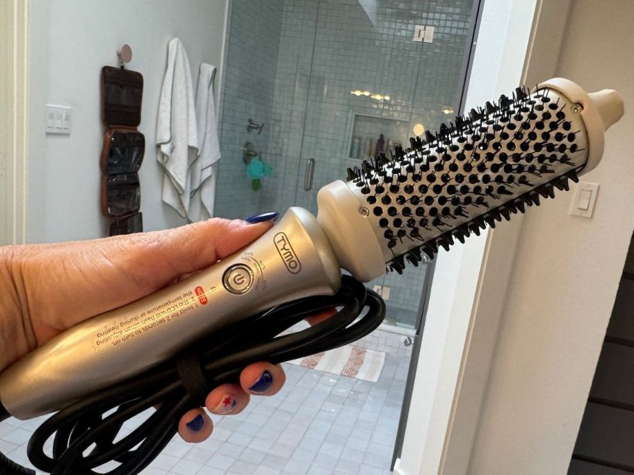 hand holding a silver TYMO Thermal Brush Heated Round Brush