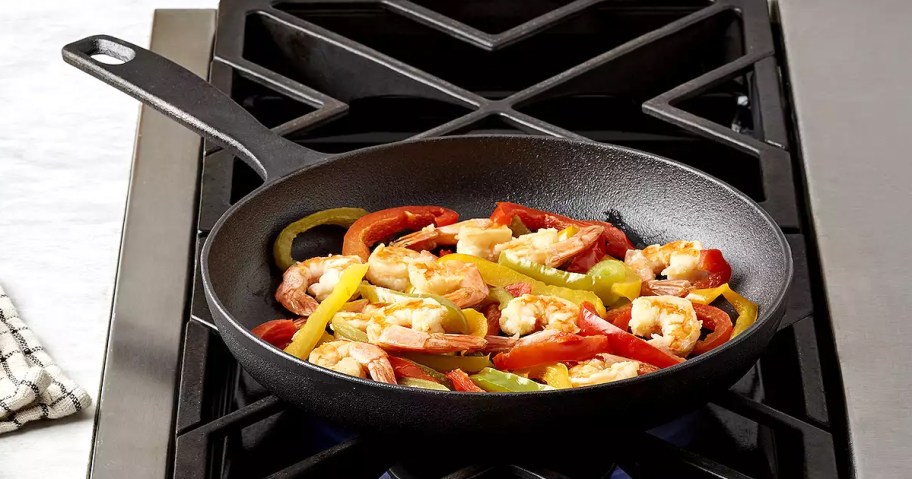 The Big One 10" Skillet on a stove top with food being cooked