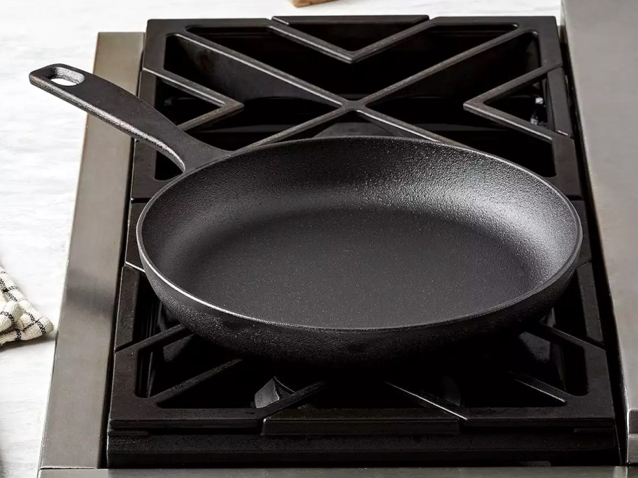 The Big One 10in Pre-Seasoned Cast-Iron Skillet sitting on a stove top