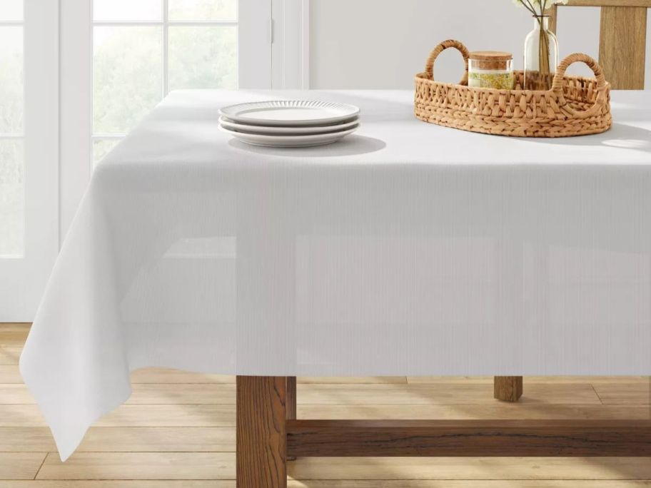 A table with a Threshold Solid White Tablecloth