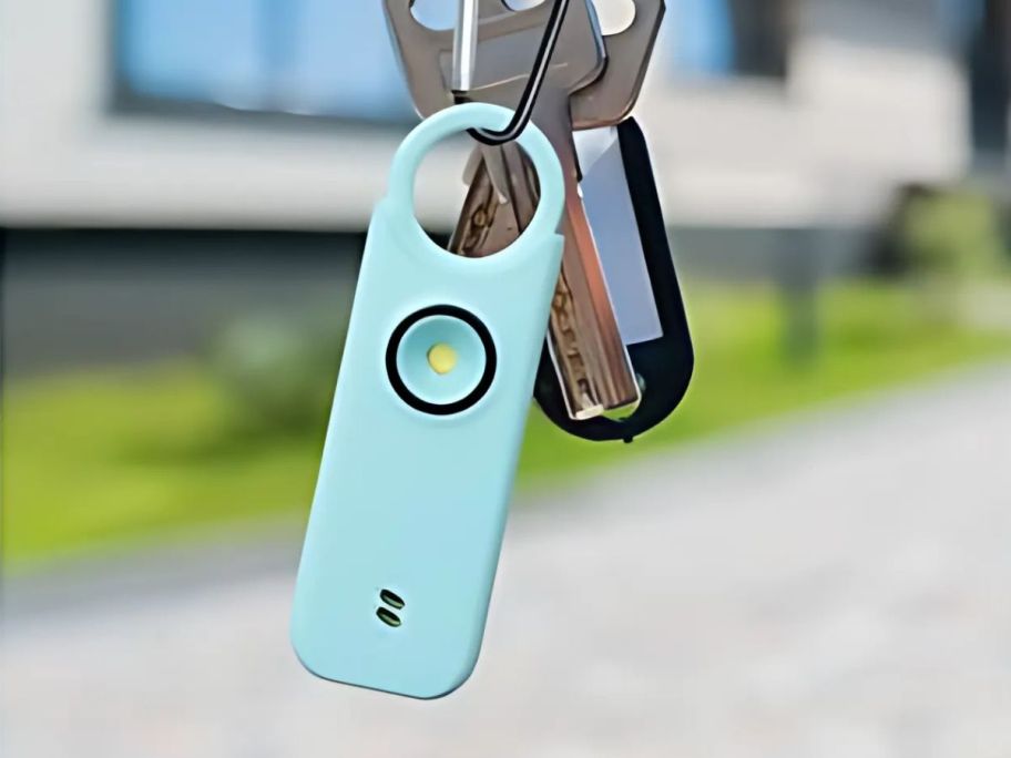 A personal safety alarm attached to a keychain