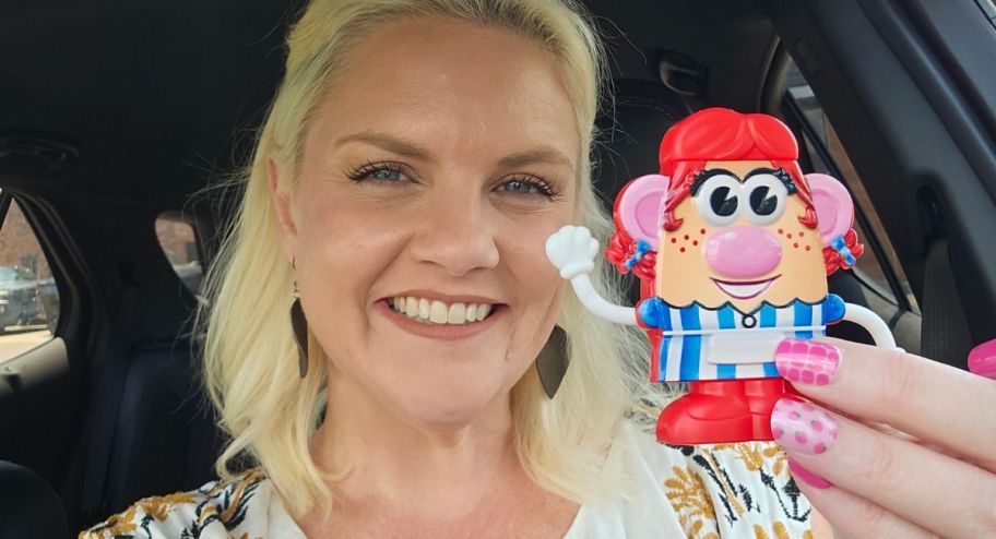 Woman holding the new mrs potato toy