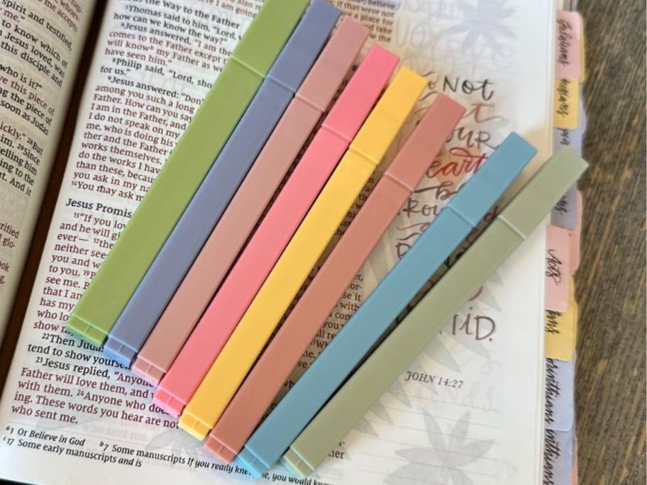 A pack of 8 pastel, square highlighters on a Bible